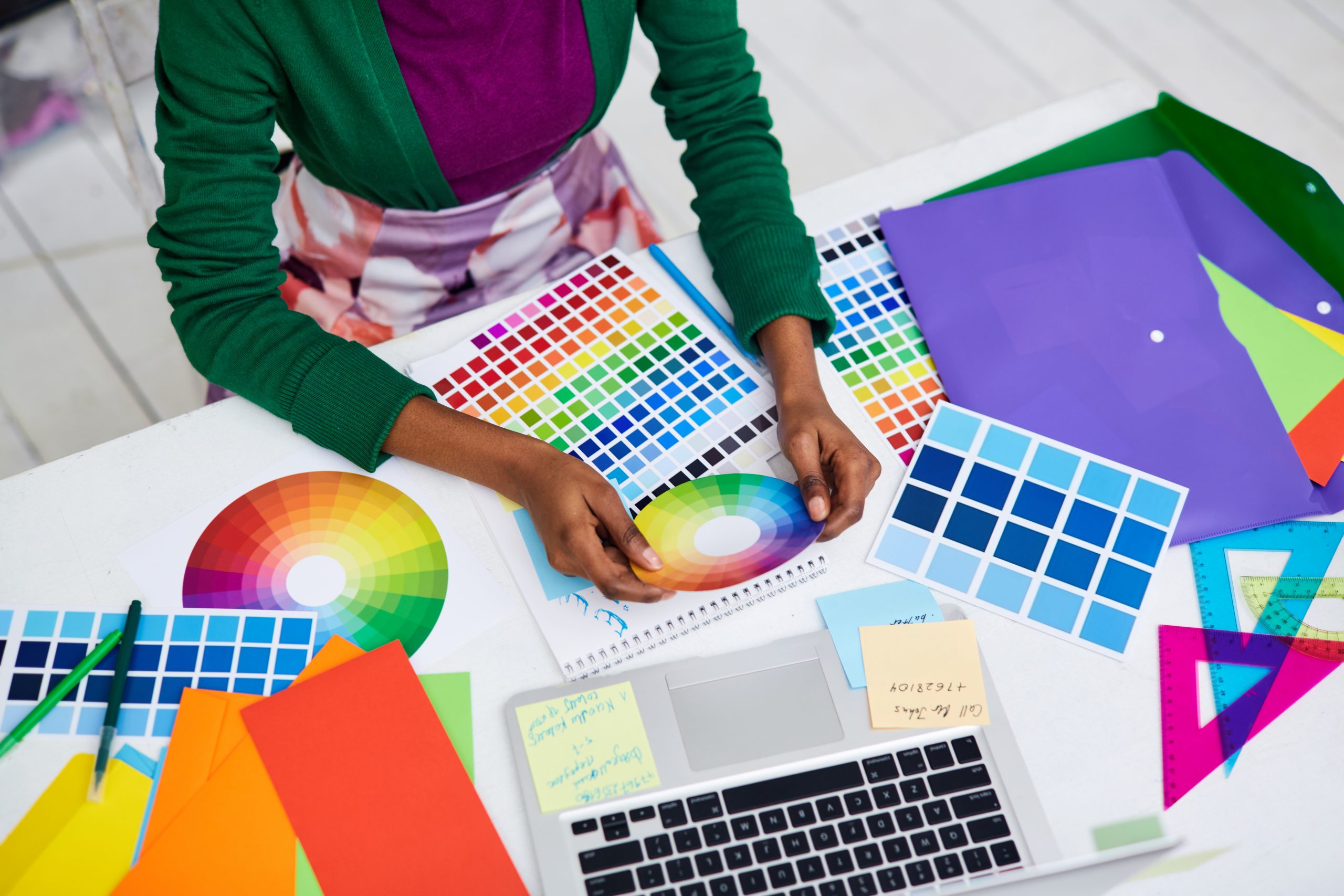 designer compares color palettes