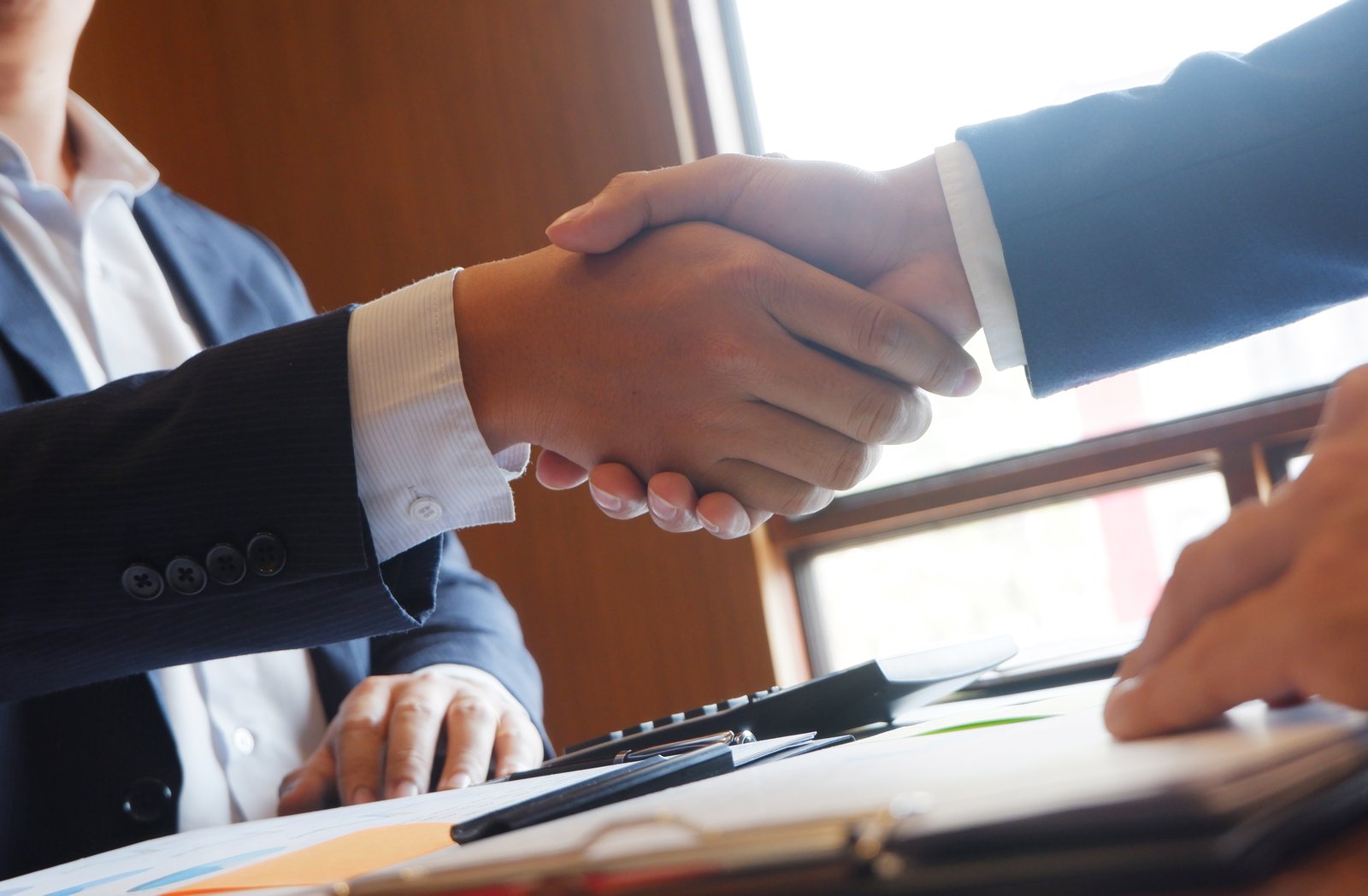 Business partners agreeing to an NDA